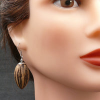 Model with Organic Natural Davidia Seed Pods- Teardrops -Australian Wooden earrings-made in Melbourne Australia-hypoallergenic