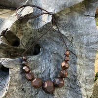 Natural handmade 15 sided Polygon wooden beaded necklace with 11 beads ranging from small to big to small again. Threaded on a waxed cotton sliding cord-made in Melbourne-Australia