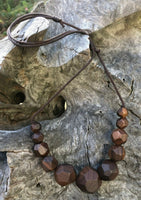 Natural handmade 15 sided Polygon wooden beaded necklace with 11 beads ranging from small to big to small again. Threaded on a waxed cotton sliding cord-made in Melbourne-Australia