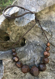 Natural handmade 15 sided Polygon wooden beaded necklace with 11 beads ranging from small to big to small again. Threaded on a waxed cotton sliding cord-made in Melbourne-Australia